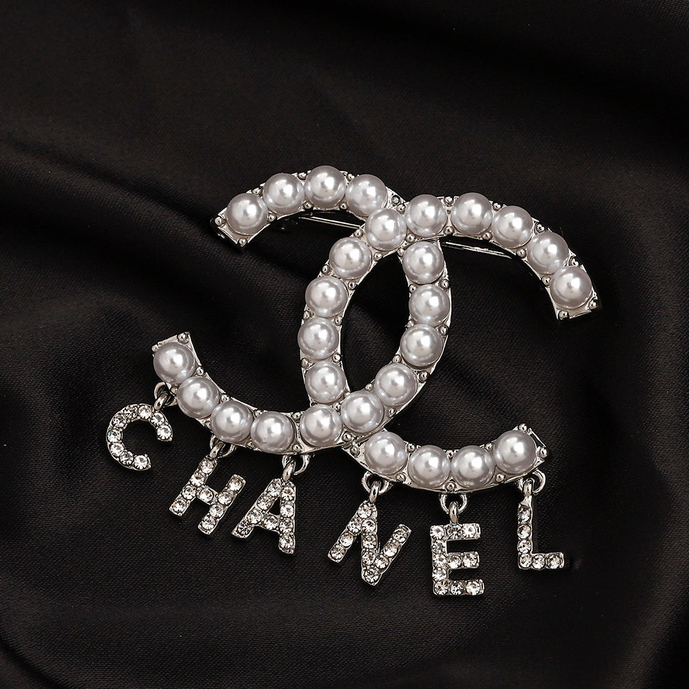 CC Pearl/zircon letters brooch