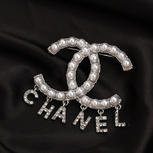 CC Pearl/zircon letters brooch